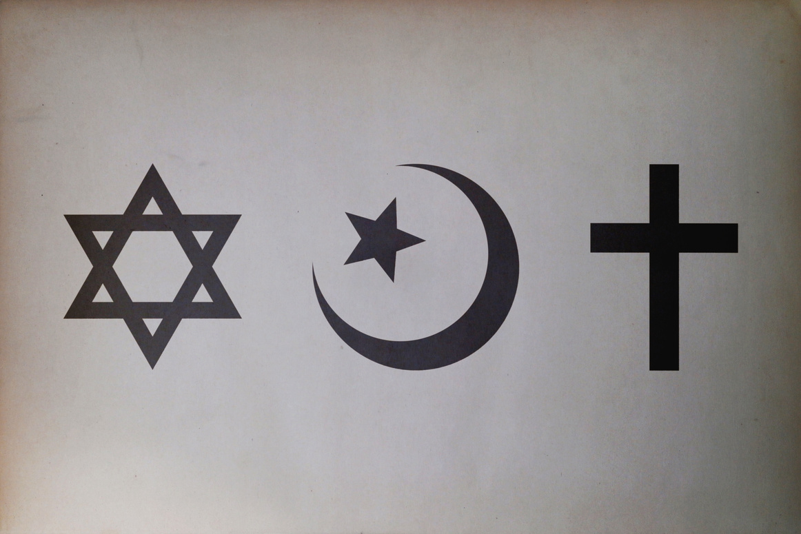 Abrahamic symbols (Judaism, Islam and Christianity) printed on paper